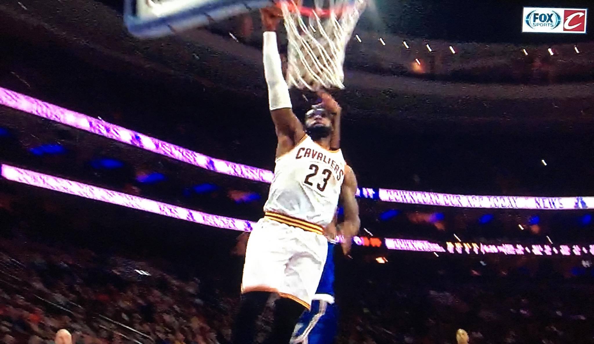 Video: LeBron James dunks ball while getting hit by Joel Embiid