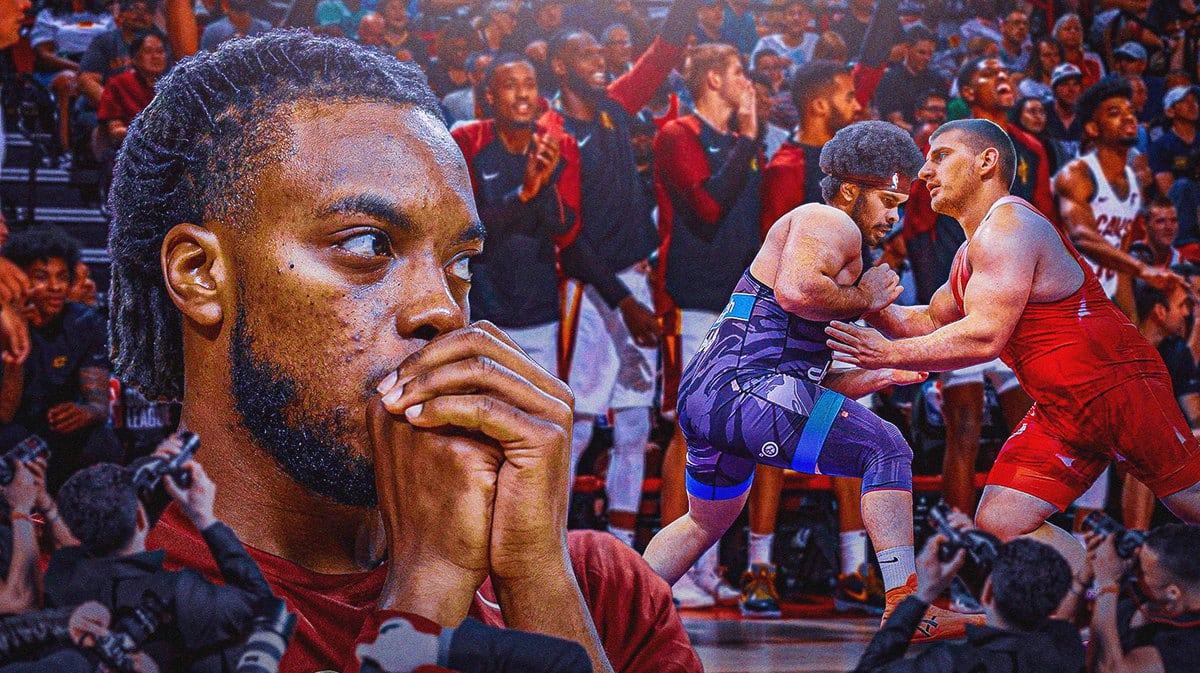 Thumb: Jarrett Allen wrestling with Nikola Jokic. Darius Garland, Cavs players watching while cheering.