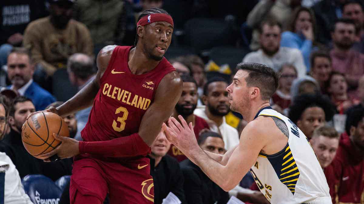 Cleveland Cavaliers guard Caris LeVert (3) holds the ball while Indiana Pacers guard T.J. McConnell (9) defends in the first half at Gainbridge Fieldhouse