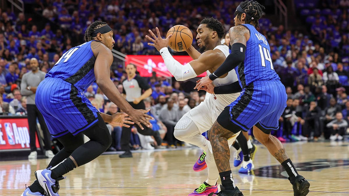 Cleveland Cavaliers guard Donovan Mitchell (45) drives to the basket against Orlando Magic guard Gary Harris (14) during the first quarter of game three of the first round for the 2024 NBA playoffs at Kia Center