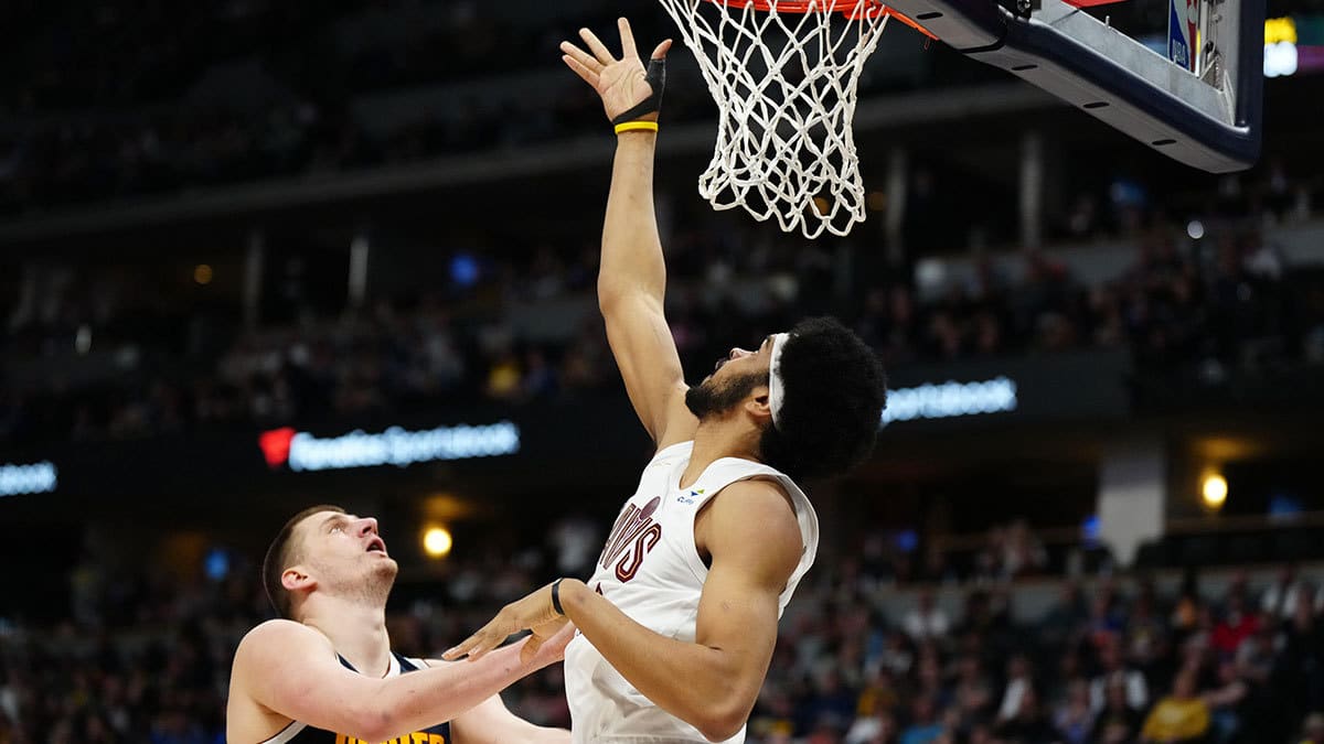 Cleveland Cavaliers center Jarrett Allen (31) shoots over Denver Nuggets center Nikola Jokic (15) in the second half at Ball Arena