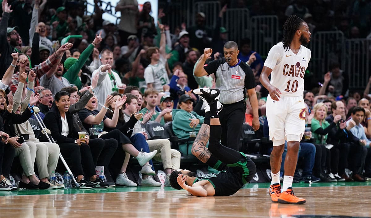 Boston Celtics forward Jayson Tatum (0) shoots for three points against Cleveland Cavaliers guard Darius Garland (10) 