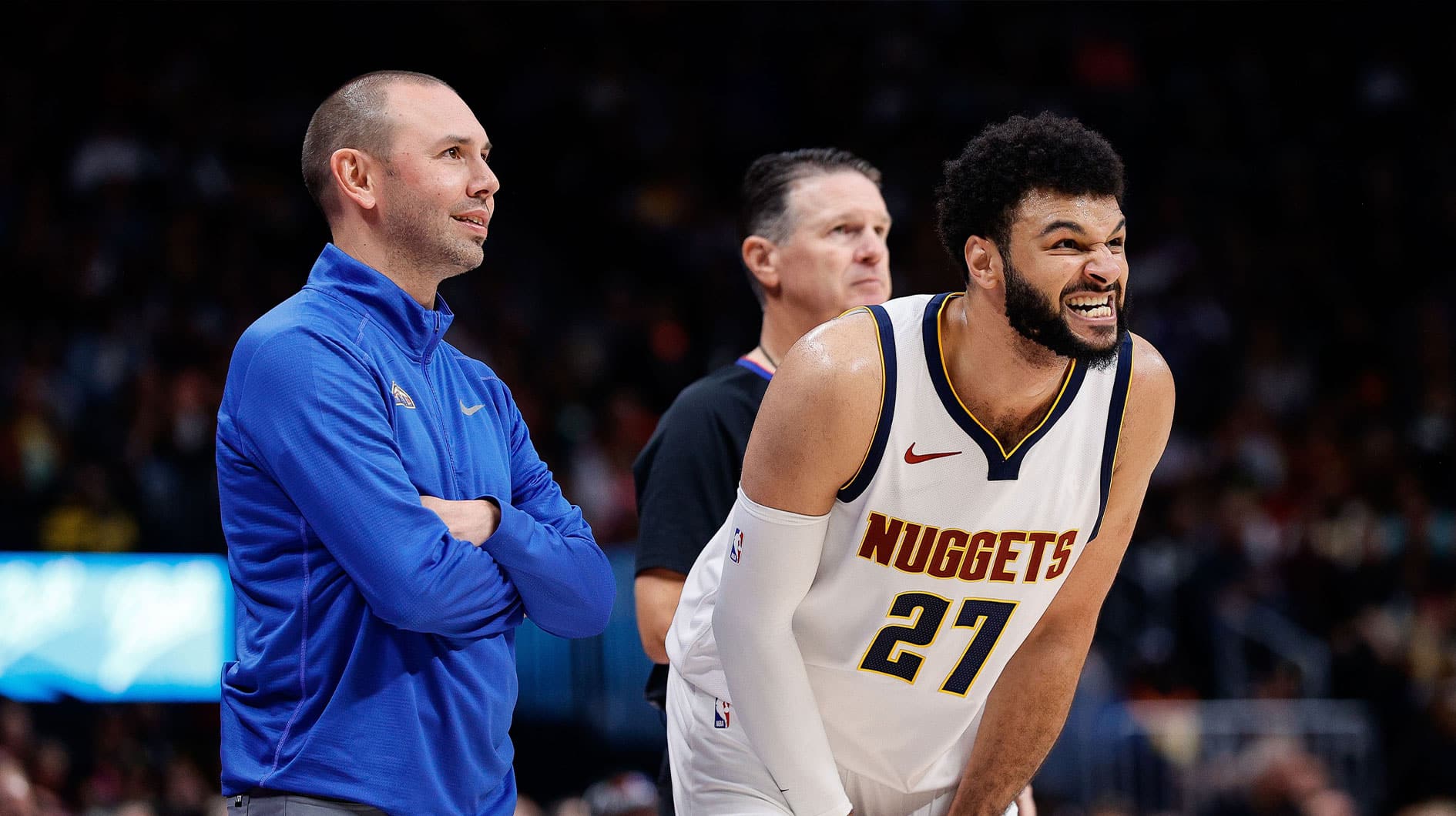 Oct 15, 2023; Denver, Colorado, USA; Denver Nuggets guard Jamal Murray (27) holds his hand as assistant coach David Adelman looks on in the third quarter against the Chicago Bulls at Ball Arena. Mandatory Credit: Isaiah J. Downing-USA TODAY Sports