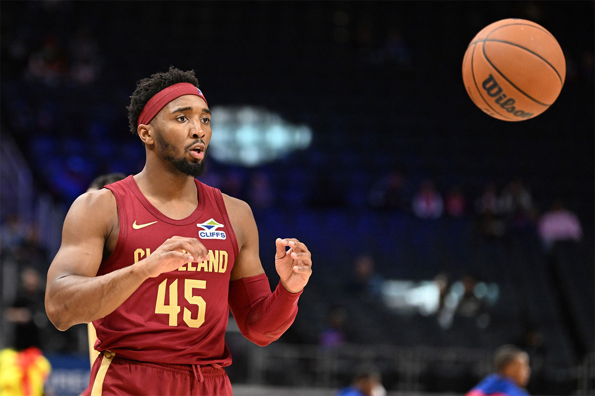 Cavaliers guard Donovan Mitchell (45) warms up before a preseason game against the Detroit Pistons at Little Caesars Arena