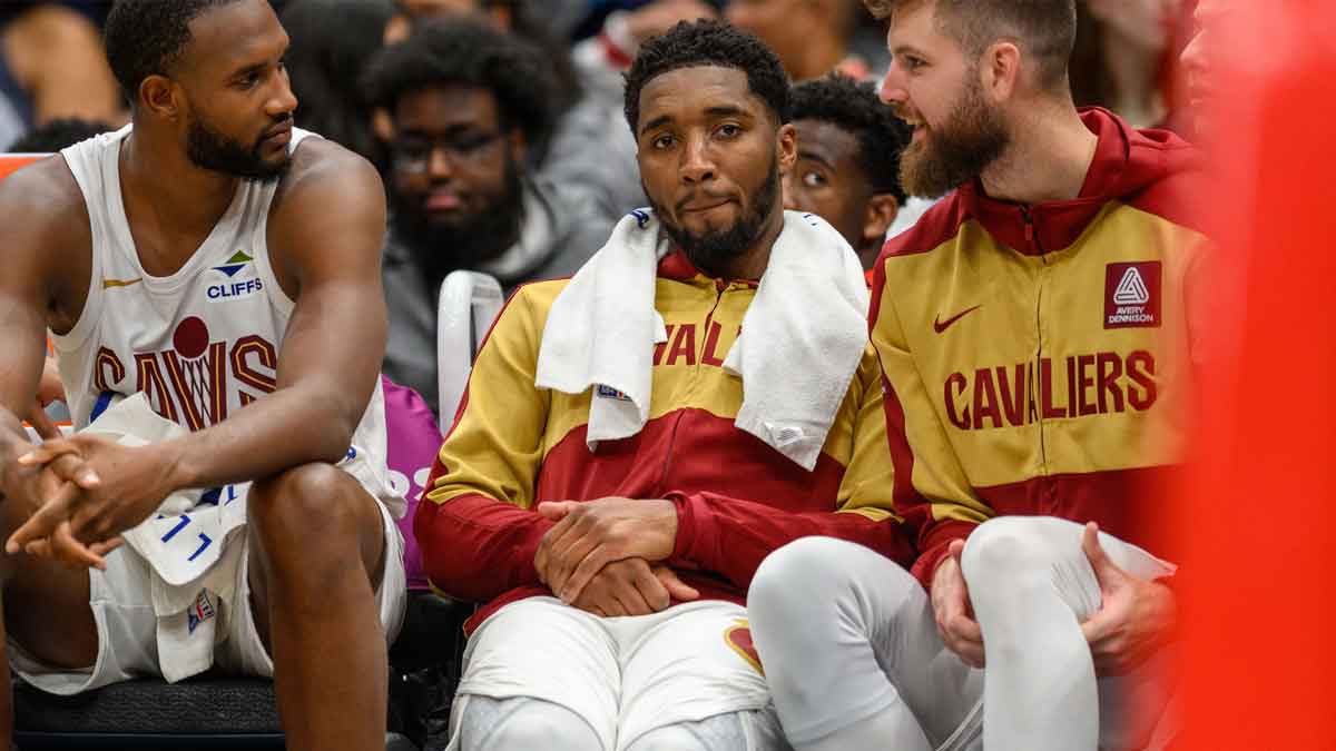 Cavaliers guard Donovan Mitchell (45) reacts on the bench with forward Evan Mobley (4) during the fourth quarter against the Washington Wizards at Capital One Arena