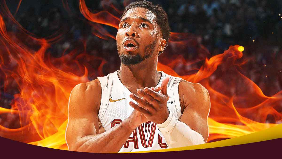 Donovan Mitchell in Cavs uniform with flames all around him