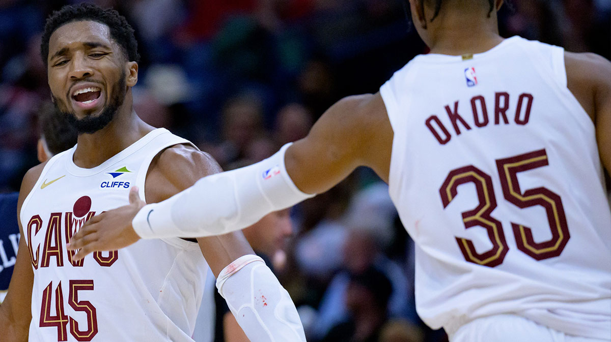 Cavaliers guard Donovan Mitchell (45) celebrates with Cleveland Cavaliers forward Isaac Okoro (35) against the New Orleans Pelicans during the fourth quarter at Smoothie King Center