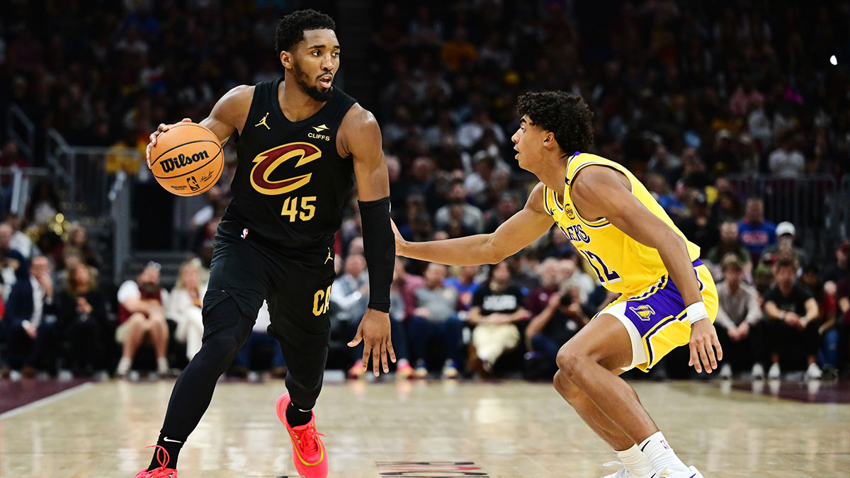 Lakers guard Max Christie (12) defends Cleveland Cavaliers guard Donovan Mitchell (45) during the first half at Rocket Mortgage FieldHouse.