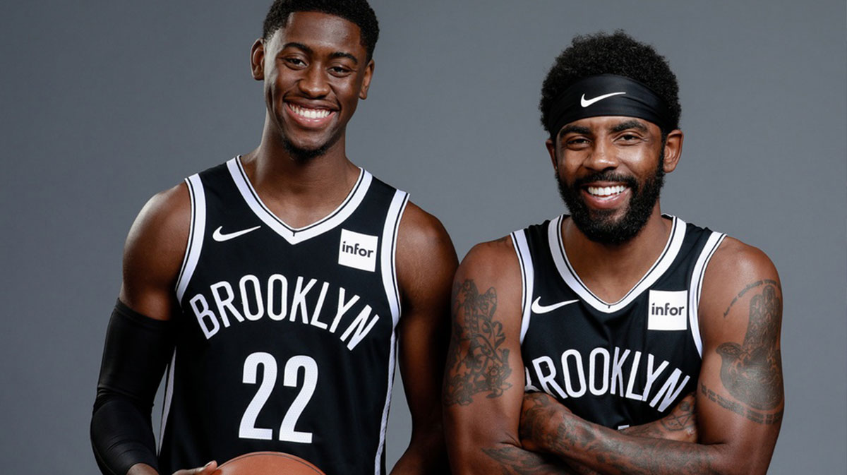 Brooklyn Nets guard Caris LeVert (22) and Brooklyn Nets guard Kyrie Irving (11) pose for a portrait during media day at HSS Training Center.