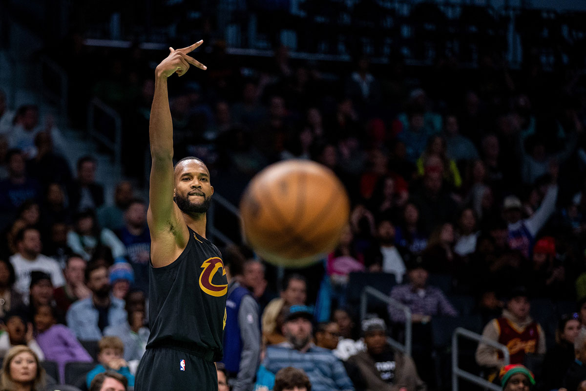 Cavaliers forward Evan Mobley (4) celebrates a three point basket against the Charlotte Hornets during the fourth quarter at Spectrum Center