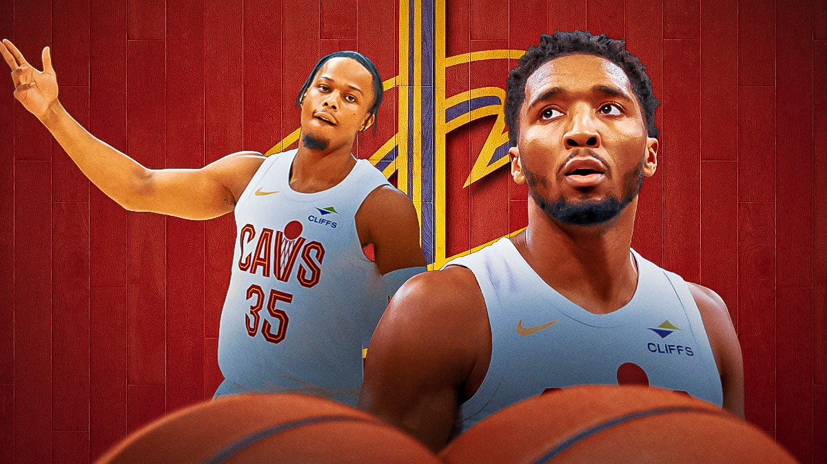 Cavs' All-Star Donovan Mitchell next to Cavs forward Isaac Okoro with the Cavs logo in the background