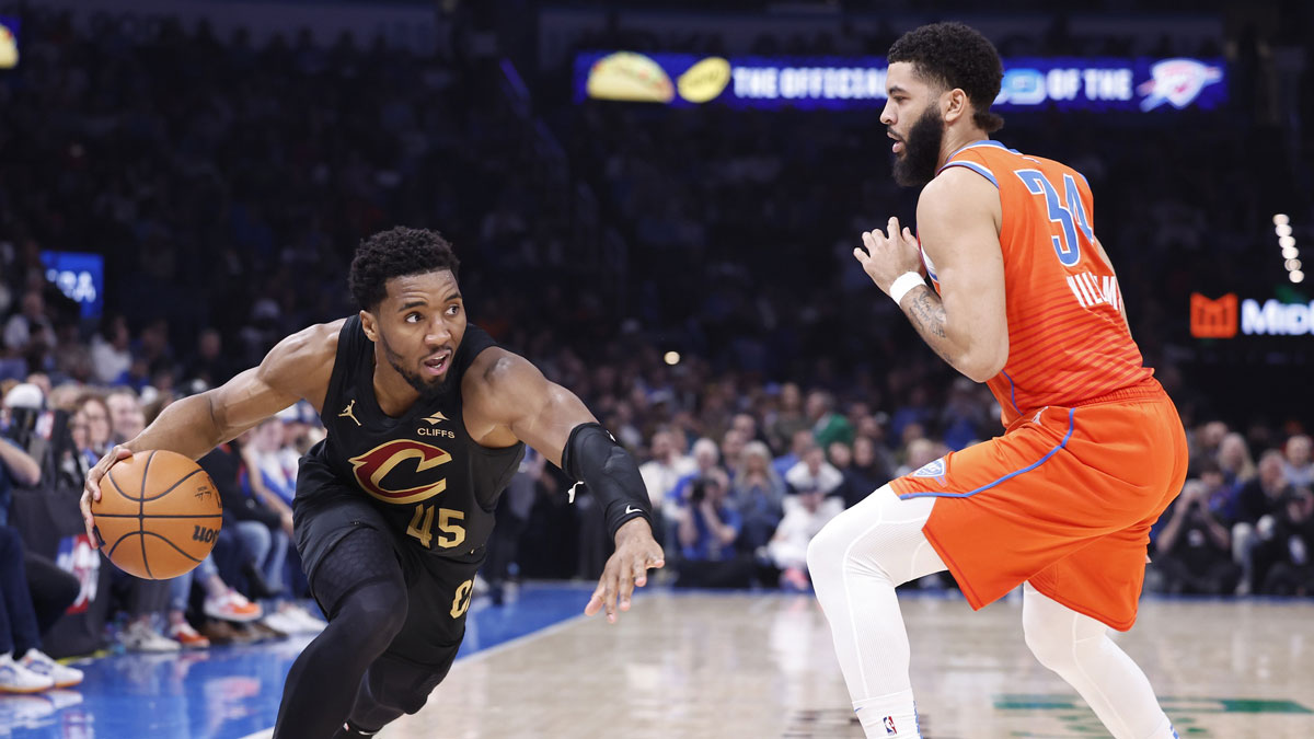 Cavaliers guard Donovan Mitchell (45) drives around Oklahoma City Thunder forward Kenrich Williams (34) during the second quarter at Paycom Center