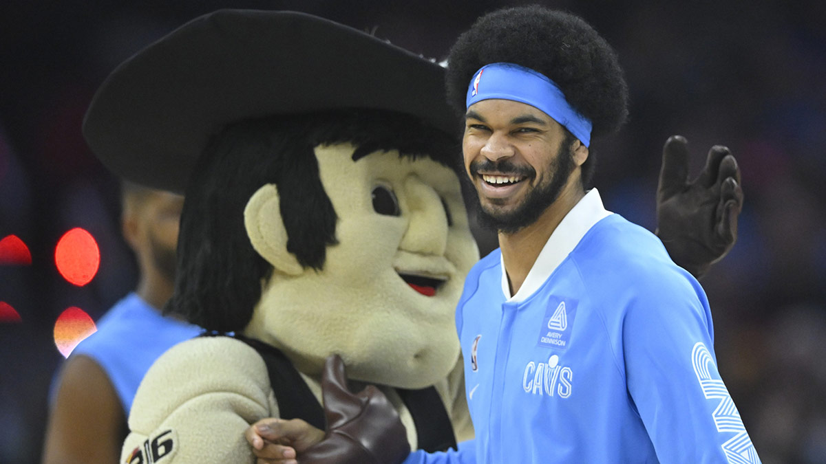 Cavaliers center Jarrett Allen (31) and mascot Sir CC react before a game against the Utah Jazz at Rocket Mortgage FieldHouse