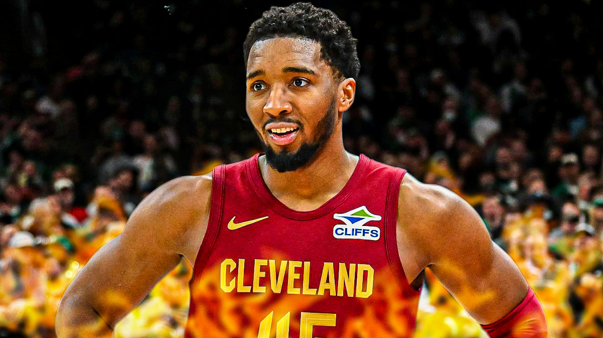 Cleveland Cavaliers star Donovan Mitchell with fire around him in front of Rocket Mortgage Fieldhouse.