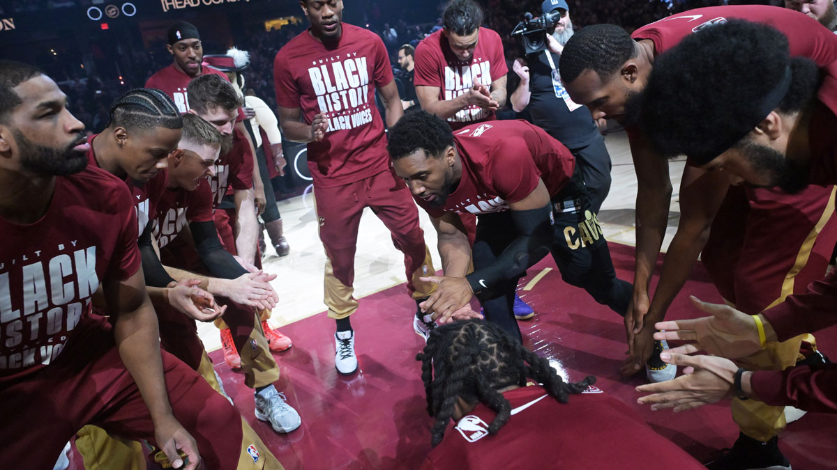 Cavaliers guard Donovan Mitchell (45) riles up his teammates before the game between the Cavaliers and the New York Knicks at Rocket Arena