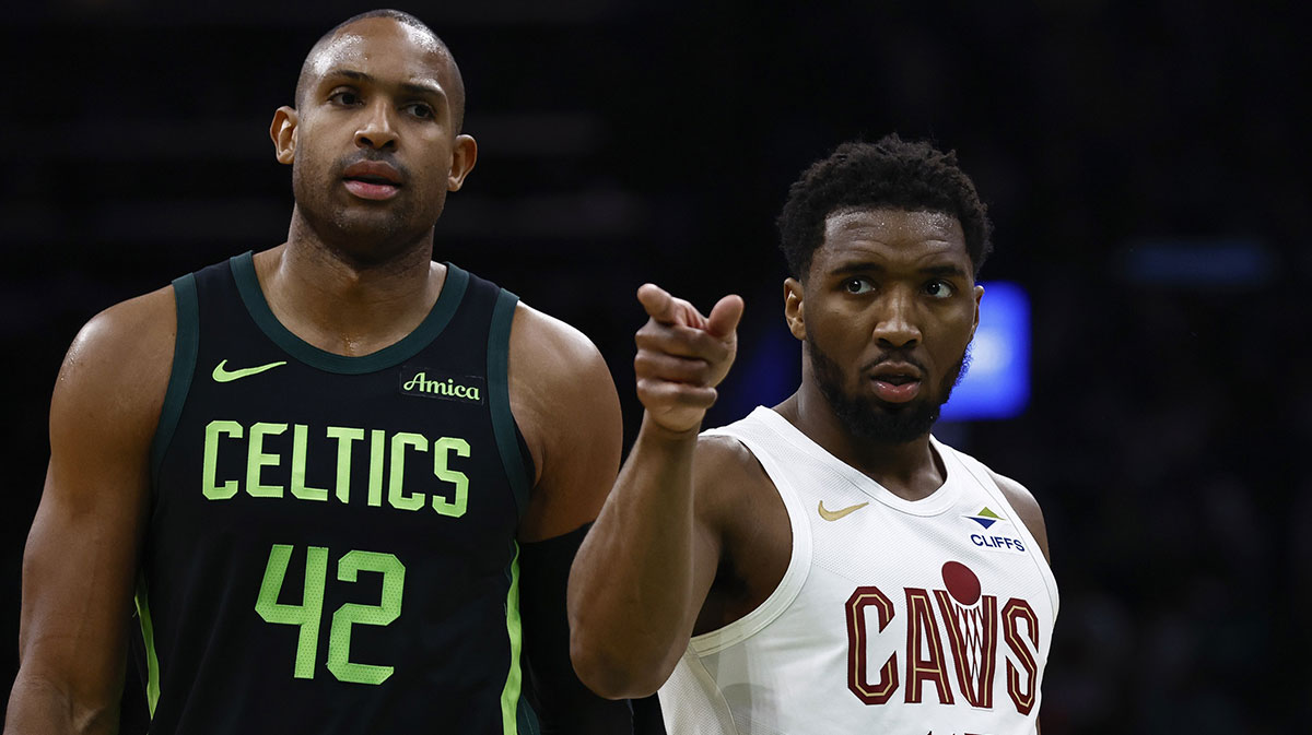 Cavs guard Donovan Mitchell points to teammate