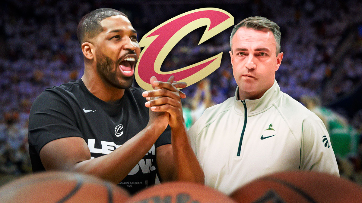 Cavs forward Tristan Thompson yelling next to Raptors head coach Darko Rajakovic with the Cavs logo in the background