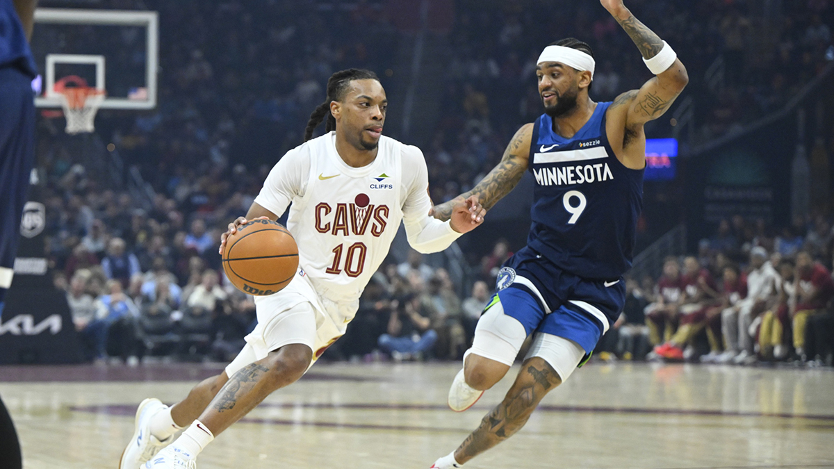 Cleveland Cavaliers guard Darius Garland (10) dribbles beside Minnesota Timberwolves guard Nickeil Alexander-Walker (9) in the first quarter at Rocket Mortgage FieldHouse.