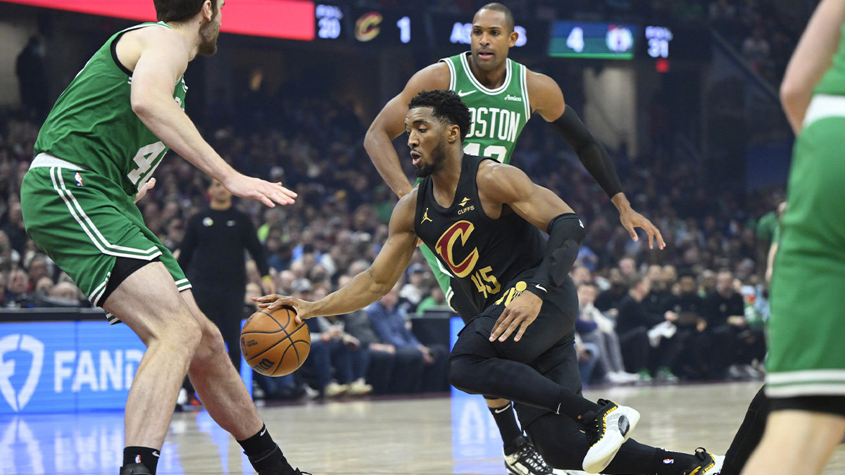 Cleveland Cavaliers guard Donovan Mitchell (45) dribbles in the first quarter against the Boston Celtics at Rocket Mortgage FieldHouse.