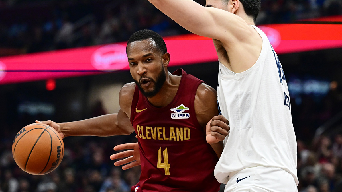 Cleveland Cavaliers forward Evan Mobley (4) drives to the basket against Memphis Grizzlies center Zach Edey (14) during the first half at Rocket Arena.