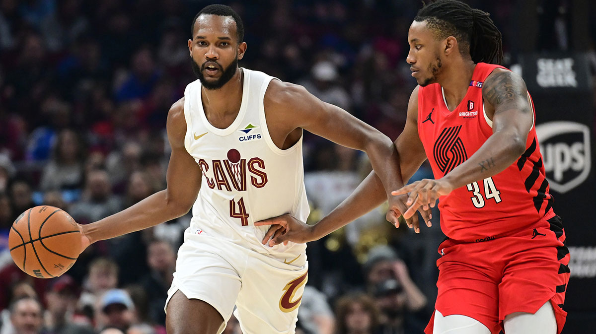 Cavaliers forward Evan Mobley (4) brings the ball up court against Portland Trail Blazers forward Jabari Walker (34) during the first half at Rocket Arena