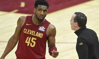 Cavaliers guard Donovan Mitchell (45) talks to head coach Kenny Atkinson in the fourth quarter against the Houston Rockets at Rocket Mortgage FieldHouse