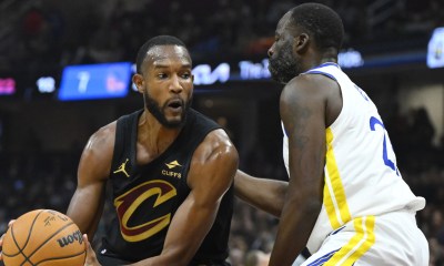 Warriors forward Draymond Green (23) defends Cleveland Cavaliers forward Evan Mobley (4) in the first quarter at Rocket Mortgage FieldHouse