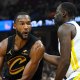 Cavs All-Star Evan Mobley next to Warriors veteran Draymond Green
