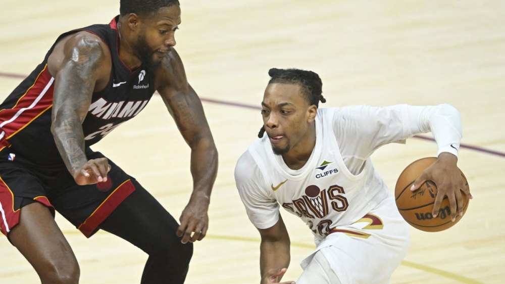 Miami Heat forward Haywood Highsmith (24) defends Cleveland Cavaliers guard Darius Garland (10) in the fourth quarter of game two of the first round of the 2025 NBA Playoffs at Rocket Arena.