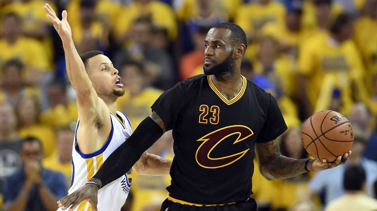 Cleveland Cavaliers forward LeBron James (23) handles the ball against Golden State Warriors guard Stephen Curry (30) during the third quarter in game seven of the NBA Finals at Oracle Arena.