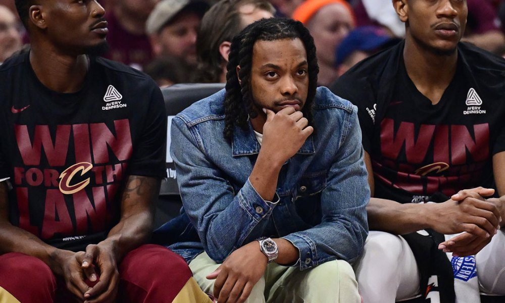 Cleveland Cavaliers guard Darius Garland, middle, watches from the bench during the first half against the Indiana Pacers in game one of the second round for the 2025 NBA Playoffs at Rocket Arena.