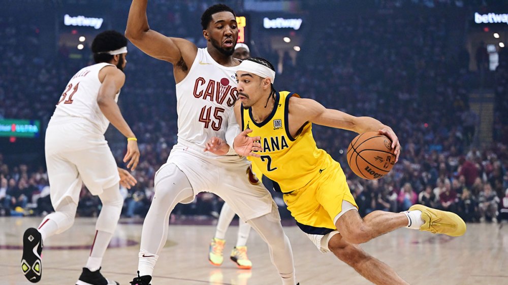Indiana Pacers guard Andrew Nembhard (2) drives to the basket against Cleveland Cavaliers guard Donovan Mitchell (45) during the first quarter in game one of the second round for the 2025 NBA Playoffs at Rocket Arena.
