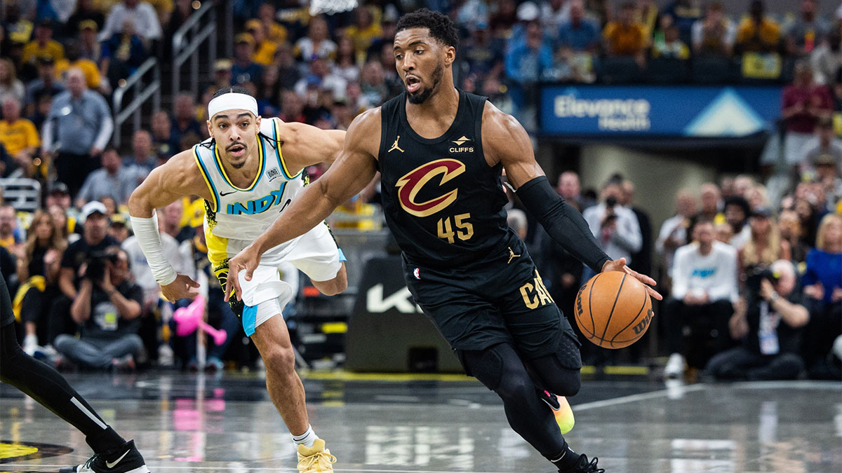 Cleveland Cavaliers guard Donovan Mitchell (45) dribbles the ball while Indiana Pacers guard Andrew Nembhard (2) defends during game four of the second round for the 2025 NBA Playoffs at Gainbridge Fieldhouse.