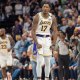 Los Angeles Lakers forward Dorian Finney-Smith (17) celebrates after scoring a three pointer agains the Minnesota Timberwolves in the fourth quarter during game four of first round for the 2025 NBA Playoffs at Target Center.