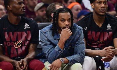 Cavaliers guard Darius Garland, middle, watches from the bench during the first half against the Indiana Pacers in game one of the second round for the 2025 NBA Playoffs at Rocket Arena