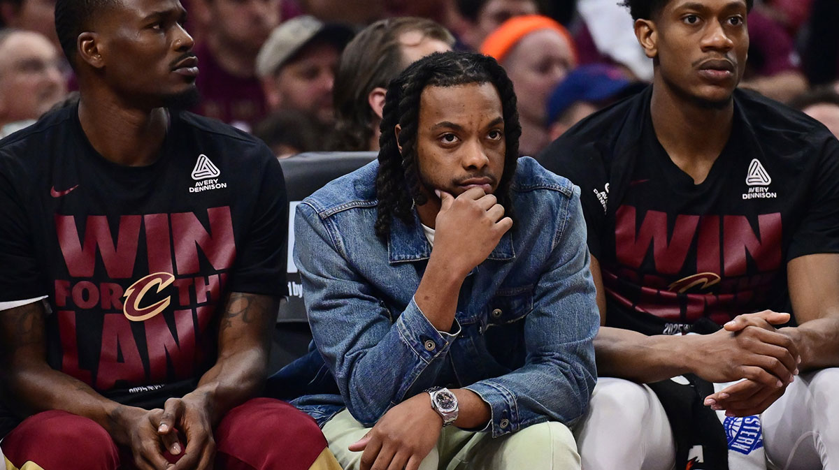 Cavaliers guard Darius Garland, middle, watches from the bench during the first half against the Indiana Pacers in game one of the second round for the 2025 NBA Playoffs at Rocket Arena