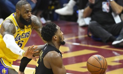 Lakers forward LeBron James (6) defends Cleveland Cavaliers guard Donovan Mitchell (45) in the fourth quarter at Rocket Mortgage FieldHouse