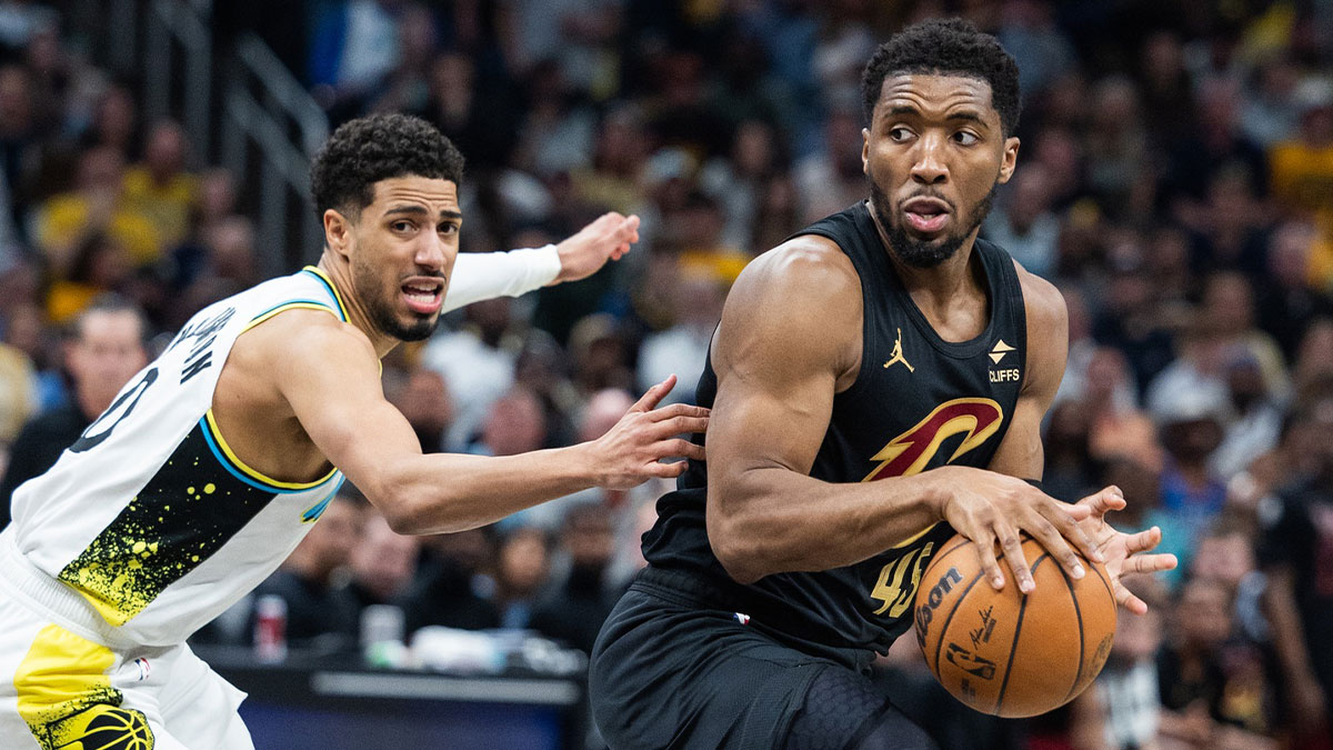 Cavaliers guard Donovan Mitchell (45) dribbles the ball while Indiana Pacers guard Tyrese Haliburton (0) defends during game four of the second round for the 2025 NBA Playoffs at Gainbridge Fieldhouse