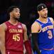 Cleveland Cavaliers guard Donovan Mitchell (45) talks to New York Knicks guard Josh Hart (3) during the second half at Rocket Arena. ndatory Credit: