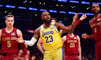 Lakers forward LeBron James (23) reacts during the first half at Crypto.com Arena with the Cavs logo in the background