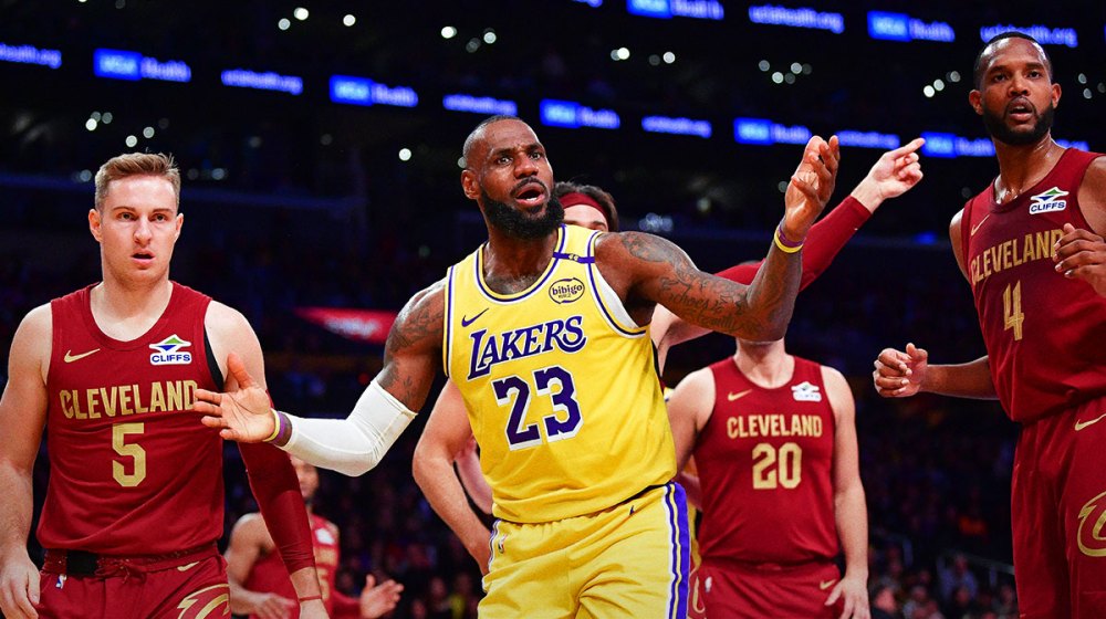 Lakers forward LeBron James (23) reacts during the first half at Crypto.com Arena with the Cavs logo in the background