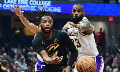 Cleveland Cavaliers guard Darius Garland (10) passes as Los Angeles Lakers forward LeBron James (23) defends during the first half at Rocket Mortgage FieldHouse.