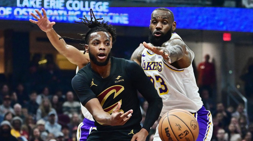 Cleveland Cavaliers guard Darius Garland (10) passes as Los Angeles Lakers forward LeBron James (23) defends during the first half at Rocket Mortgage FieldHouse.