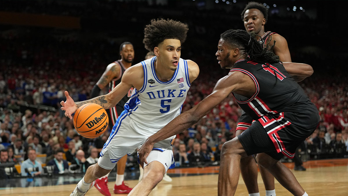 Duke Blue Devils guard Tyrese Proctor (5) drives to the basket against Houston Cougars forward Joseph Tugler (11) during the second half in the semifinals of the men's Final Four of the 2025 NCAA Tournament at the Alamodome.