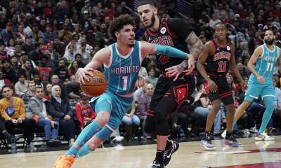 Cavs guard Lonzo Ball (2) defends Charlotte Hornets guard LaMelo Ball (1) during the second half at United Center with LaMelo Ball in the background