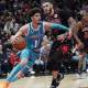 Cavs guard Lonzo Ball (2) defends Charlotte Hornets guard LaMelo Ball (1) during the second half at United Center with LaMelo Ball in the background
