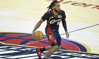 Cavaliers guard Darius Garland (10) brings the ball up court in the fourth quarter against the Philadelphia 76ers at Rocket Arena