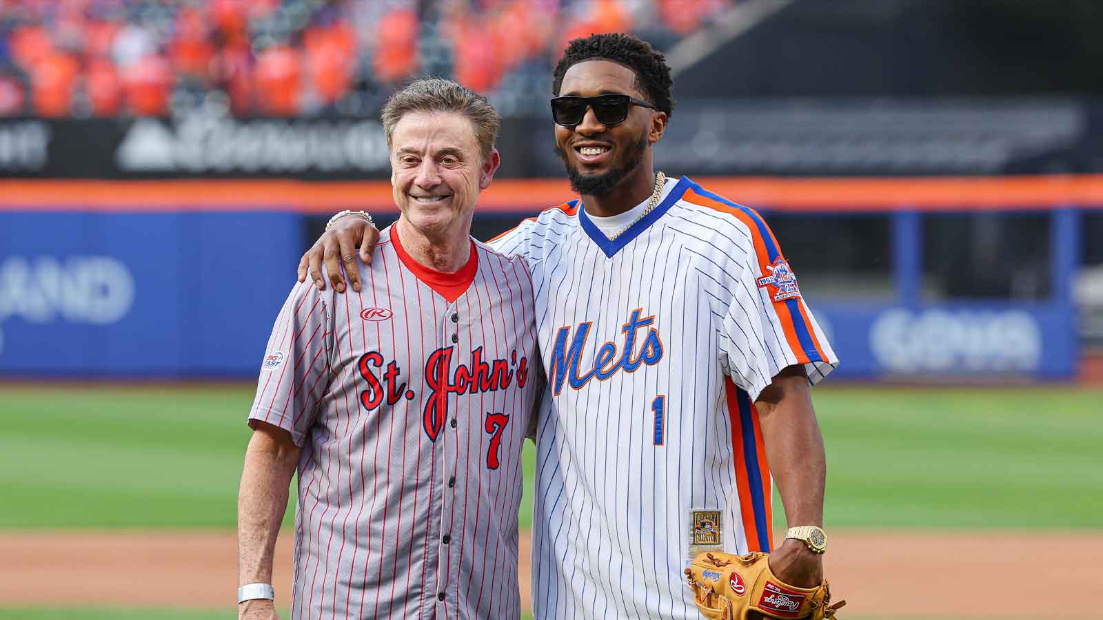 St. John's University head coach basketball coach Rick Pitino (left) and Cleveland Cavaliers guard Donovan Mitchell pose for a photo after a ceremonial first pitch before the game between the New York Mets and the New York Yankees at Citi Field