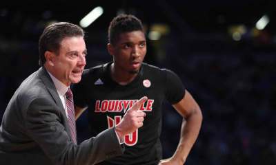 Rick Pitino talks with guard Donovan Mitchell (45) and others in the second half of their game against the Georgia Tech Yellow Jackets at McCamish Pavilion. The Cardinals won 65-50