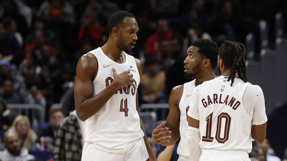 Cavaliers guard Donovan Mitchell (45) talks with Cavaliers center Evan Mobley (4) and Cavaliers guard Darius Garland (10) during a stoppage in play against the Washington Wizards in the second half at Capital One Arena